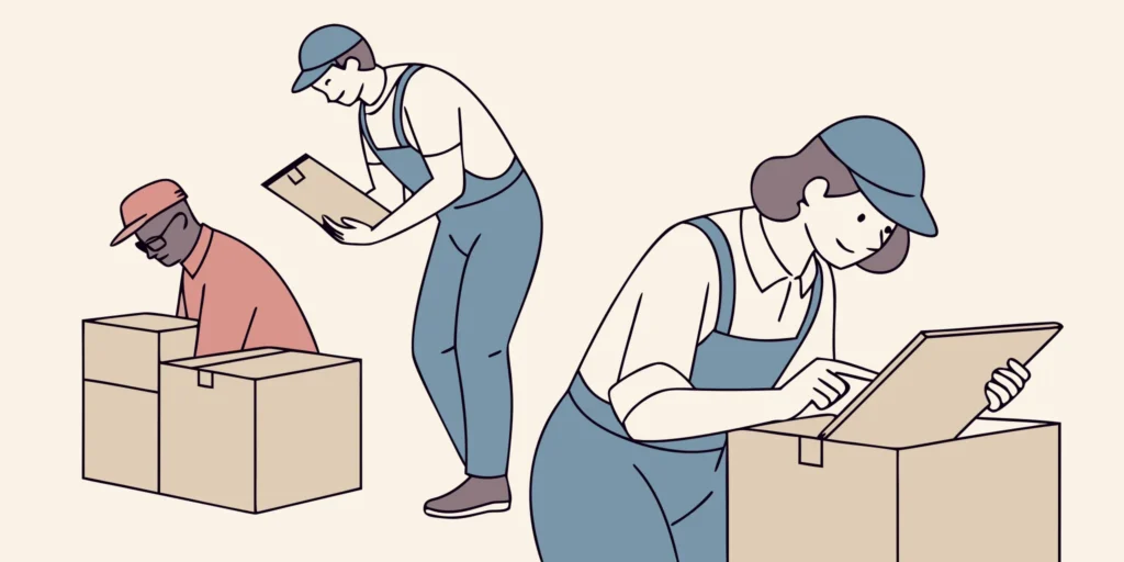 Restoration technicians packing and documenting household contents into labeled boxes under a team lead